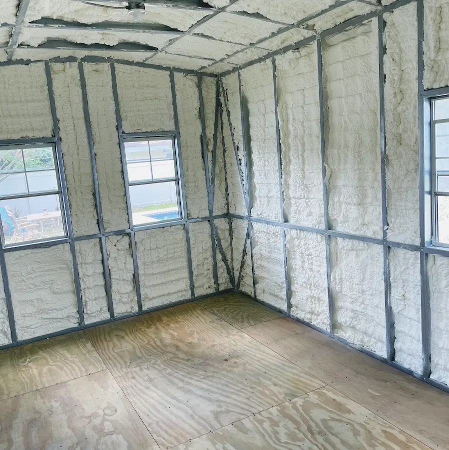 Closed-cell spray foam insulation applied to wall cavities in a residential project in Algoma